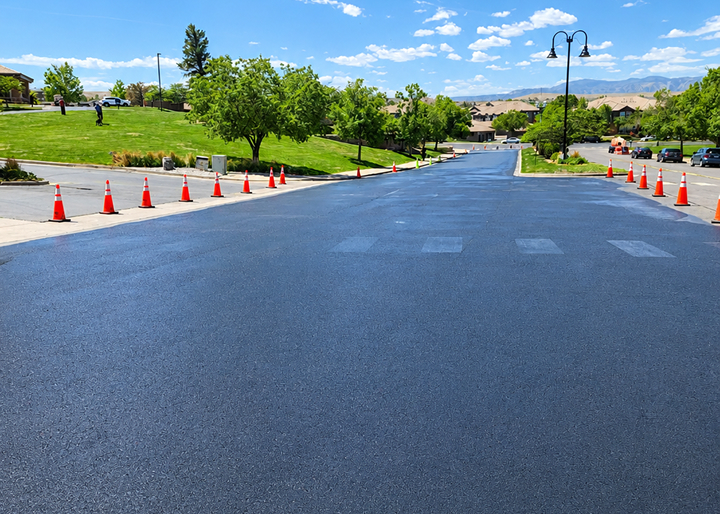Professional asphalt sealcoating project in Colorado showing freshly protected commercial pavement for long-lasting durability.