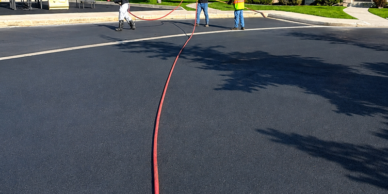 Prime Line Company providing expert parking lot striping, sealcoating, crack sealing, and pavement maintenance services.
