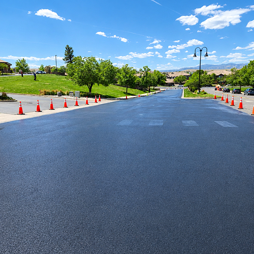 Freshly sealcoated residential community roadway completed by Prime Line Company in Colorado.